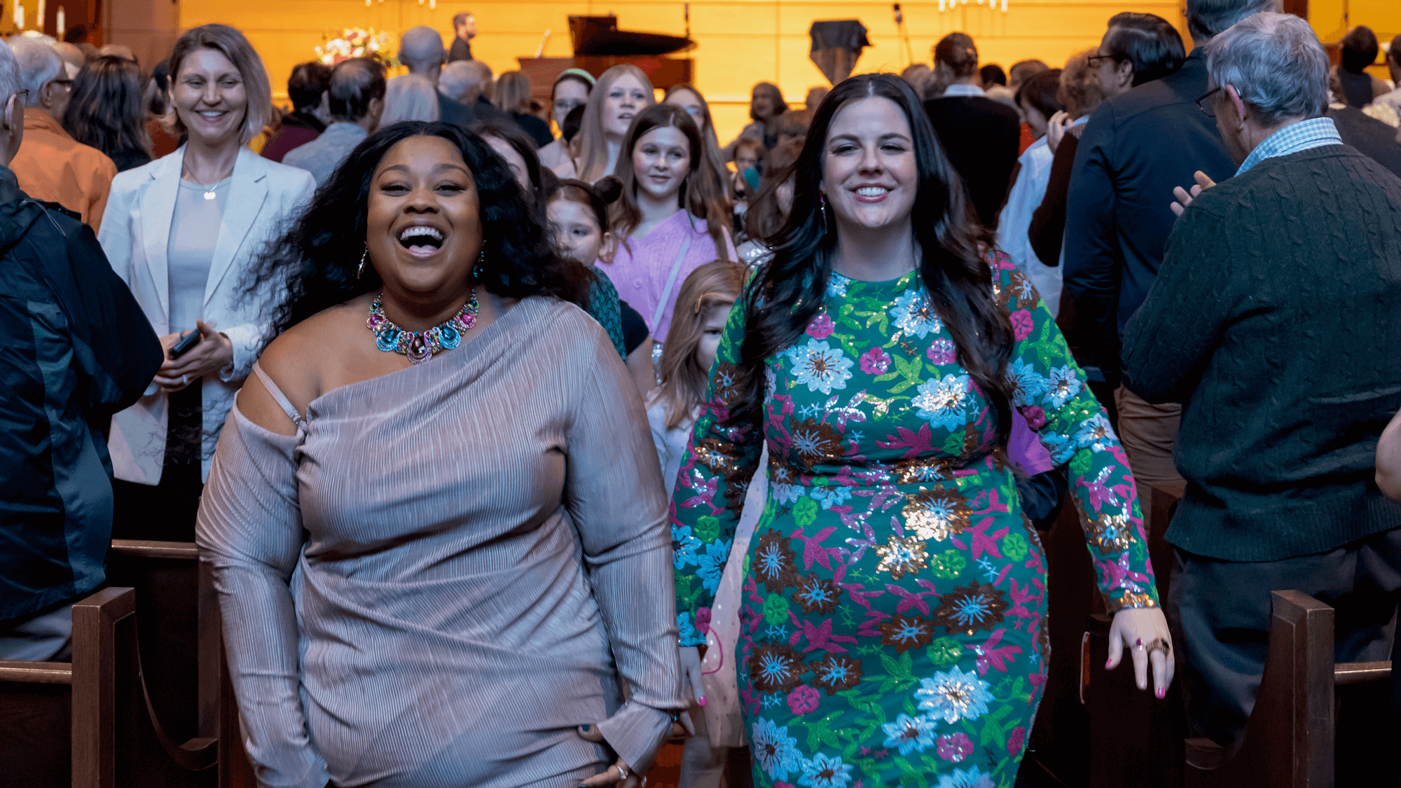 LaRiche Lamarr and Abby Krawson walking down the center sanctuary aisle
